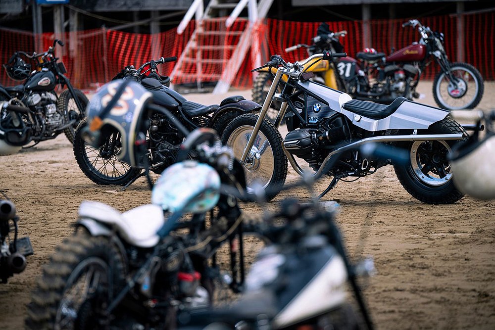 the custom R 12 on the beach surrounded by vintage motorcycles