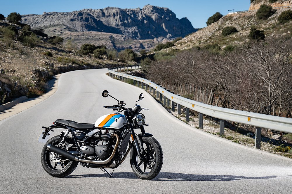 The Speed Twin 900 parked on a deserted backroad.