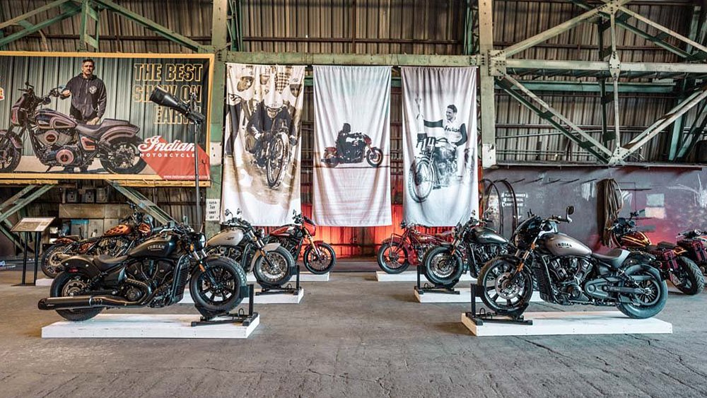 Four Indian motorcycles on display in a Portland warehouse.