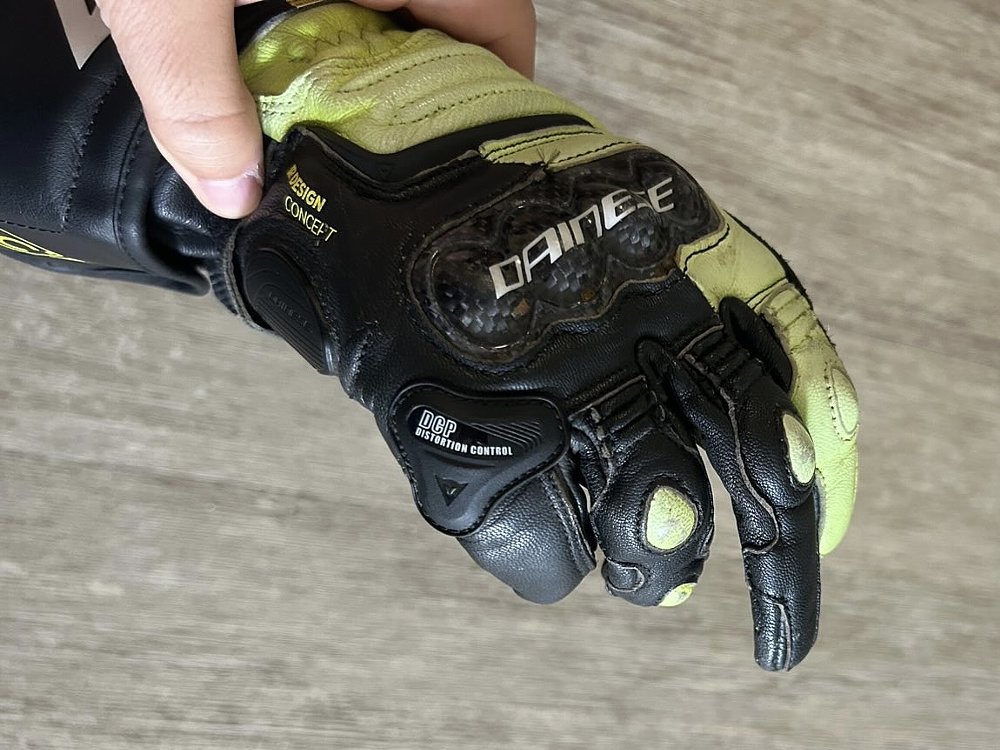 Glove deformed to cover front brake