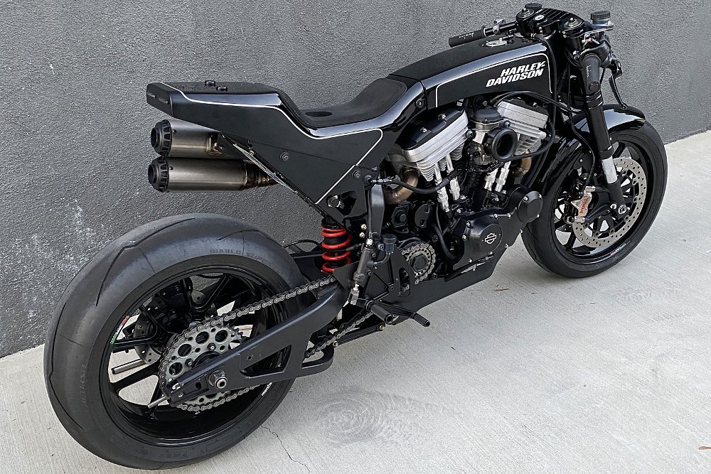 rear three-quarters view of the black, svelte, cafe-racer-style custom