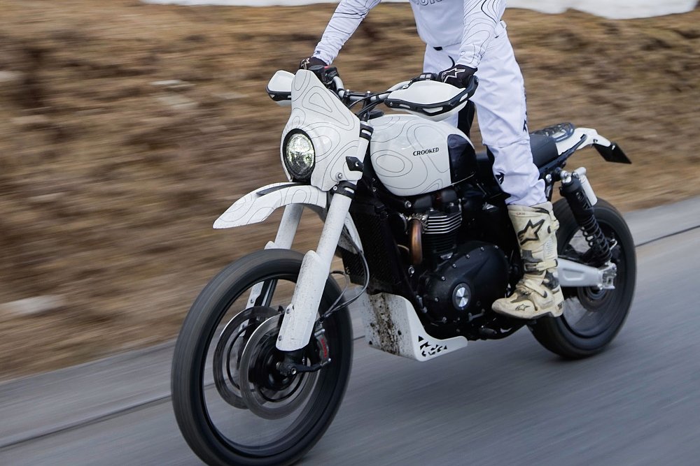 rider on the white custom on a dirt road