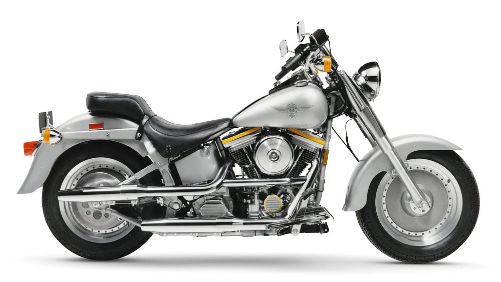 A profile view of 1990 Harley-Davidson Fat Boy against a white background.