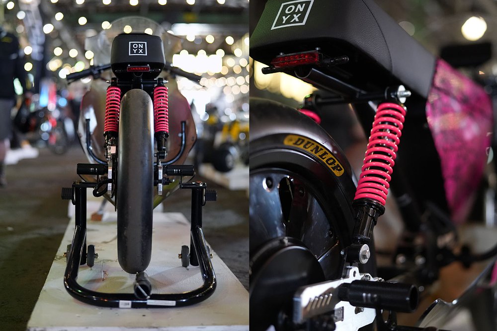 front and rear views showing the suspension with pink springs