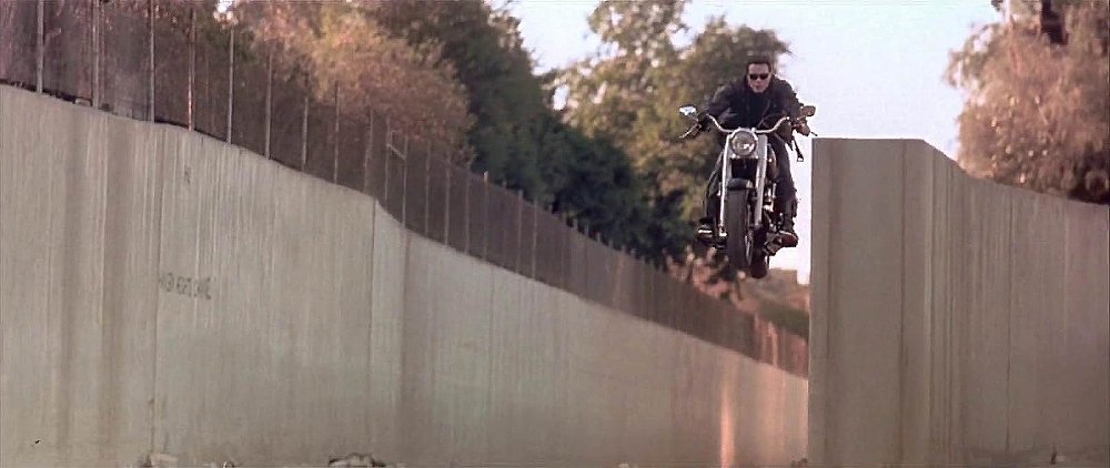 Arnold Schwarzenegger's Terminator 2 character jumps the 1991 Harley-Davidson Fat Boy into the L.A. River.
