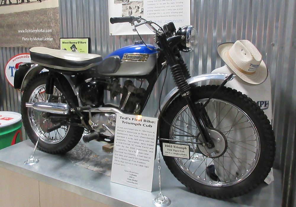 A blue single-cylinder Triumph Cub