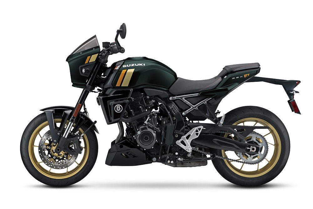 studio photo of a side view of the dark green GSX-8TT with orange and tan stripes on the tank