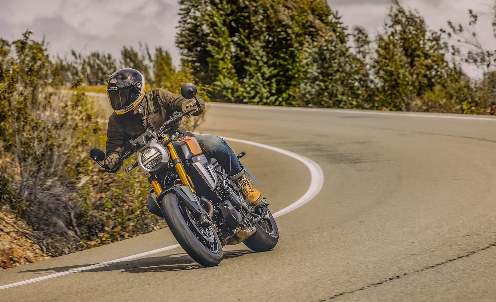 rider on the orange GSX-8T on the road