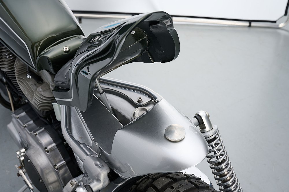 rear cowl raised on its hinge to show access to fuel tank filler