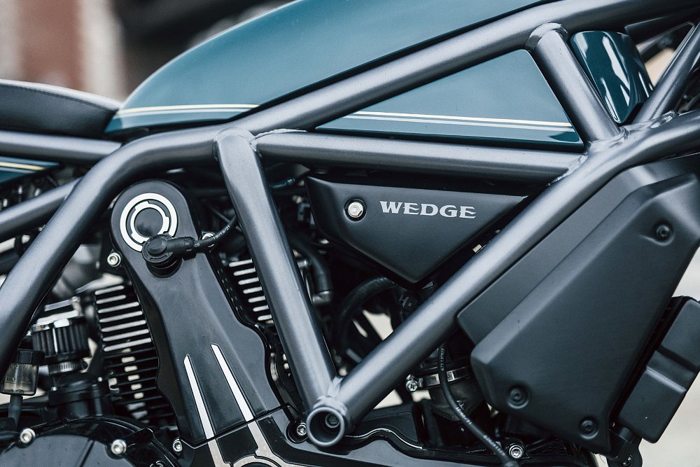 detail view of the frame and tank, which appears as if the tank is molded around the frame