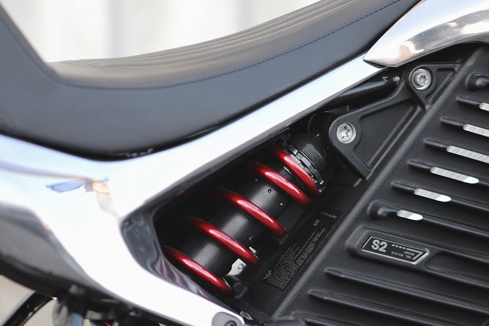 close view of red spring on shock absorber