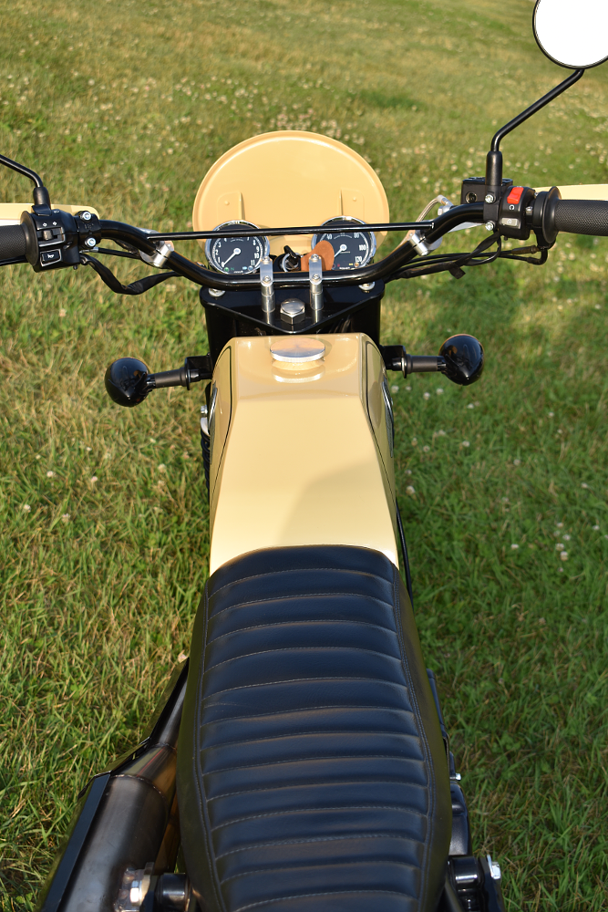 cockpit view of the bare-bones setup on the Gryffin, with two round gauges