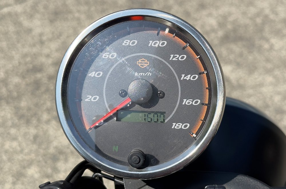 A close-up of the Harley-Davidson's X350 single round gauge.