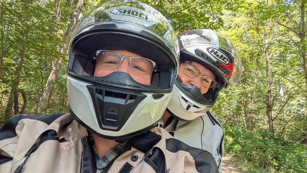 selfie of the two riders with helmets on