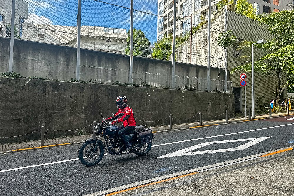 Dustin rides the GB350 through a side street of Tokyo.