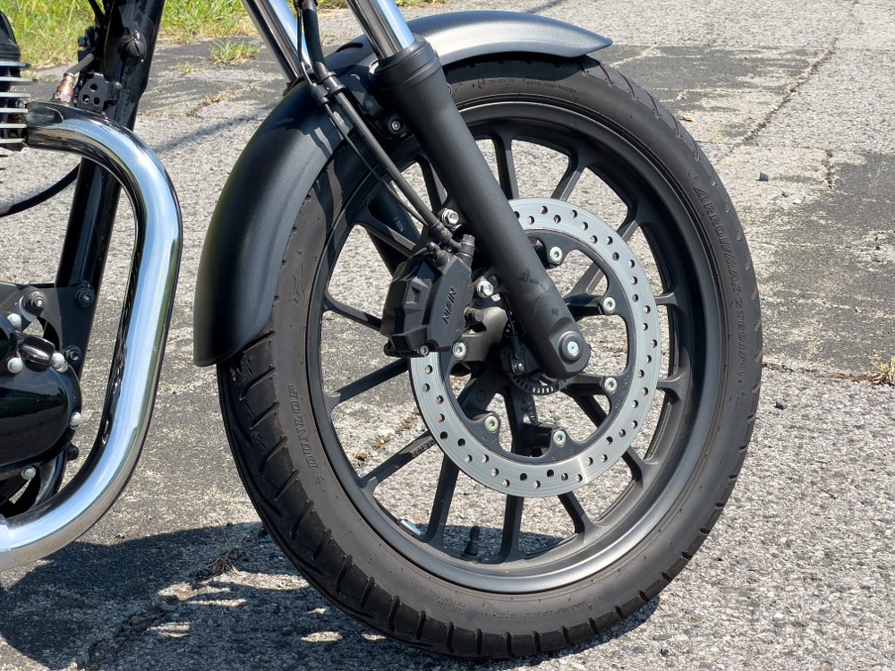 A close-up of the GB350's front wheel.