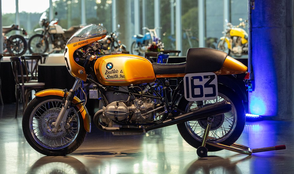 the 1976 AMA Superbike championship winning orange BMW in the museum under spotlights